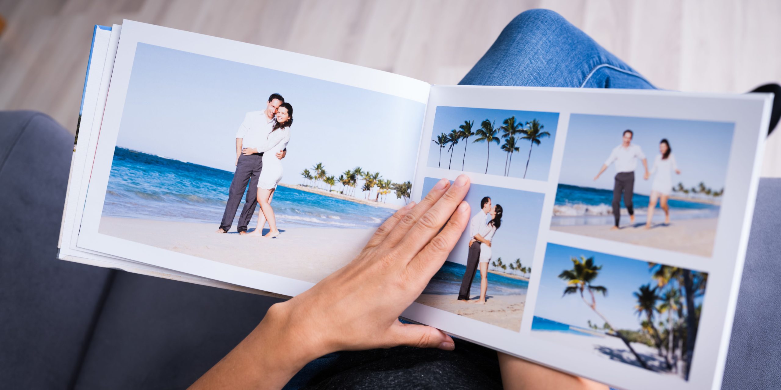 A photo of a man looking at a photo album 